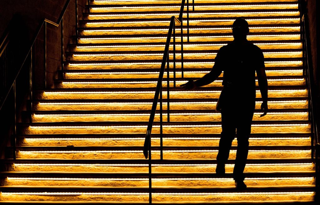 Person ascending a staircase