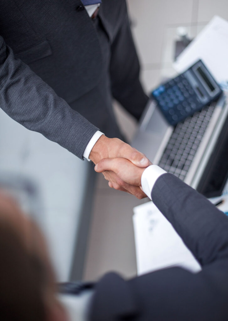 Image of handshake after successful business sales